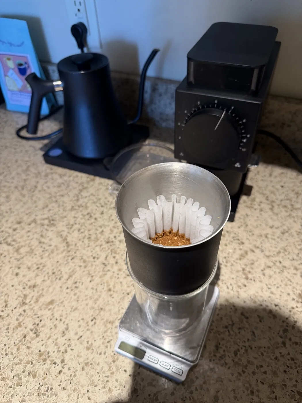 My brew setup for the Salma Bermudez: a Fellow Stagg dripper with a wave filter and freshly ground coffee on a scale, with the Fellow Ode Gen 2 grinder and kettle behind it.
